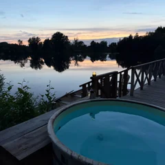 Hot tub with the sun setting in the distance